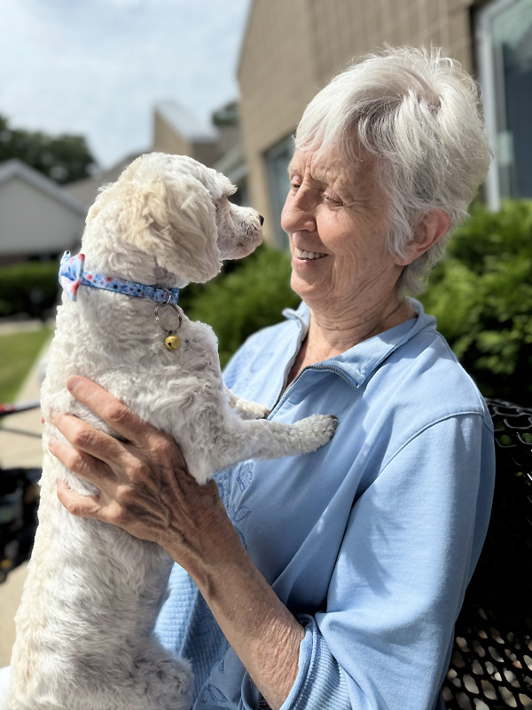 Resident smiling with craft